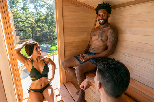 3 people relaxing in a sauna