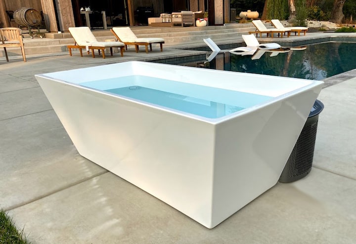 A Plunge cold tub by a pool