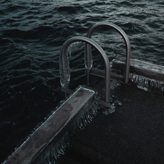 Pool stairs leading into icy water