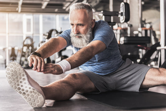 athletic older man stretching