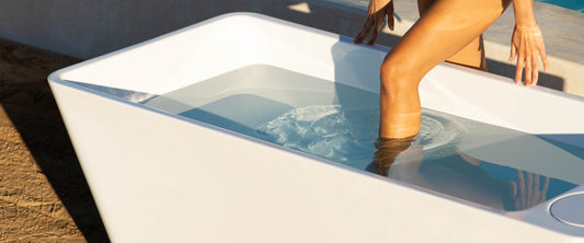 woman stepping into plunge all-in tub