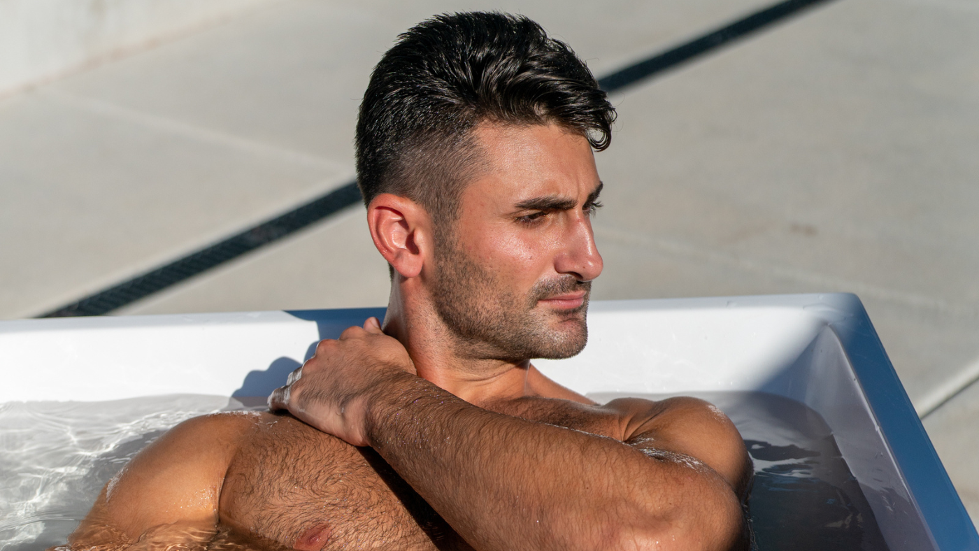 man sitting in cold plunge tub