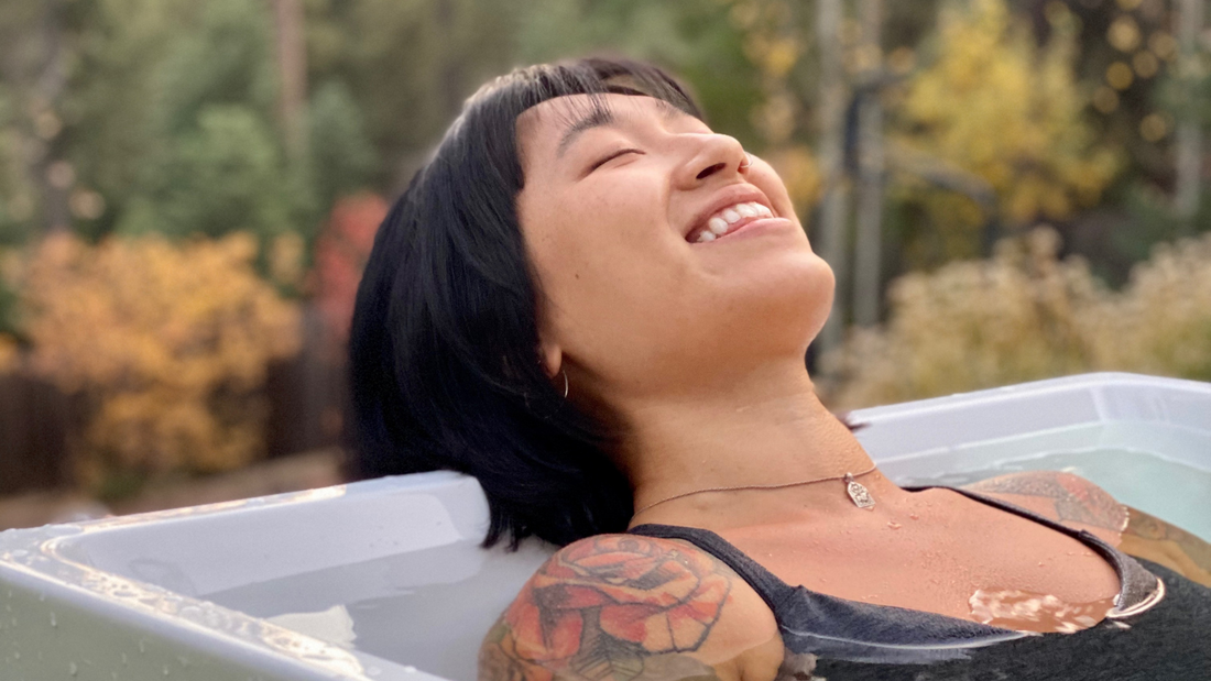 woman smiling in a Plunge tub