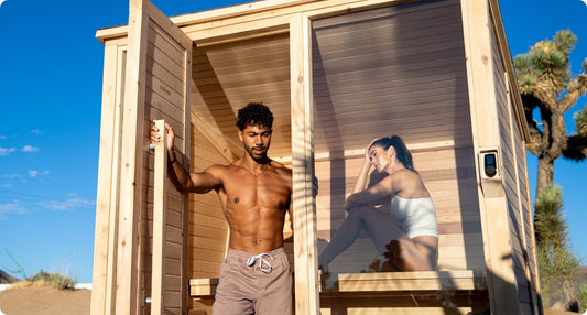 man and woman using a sauna