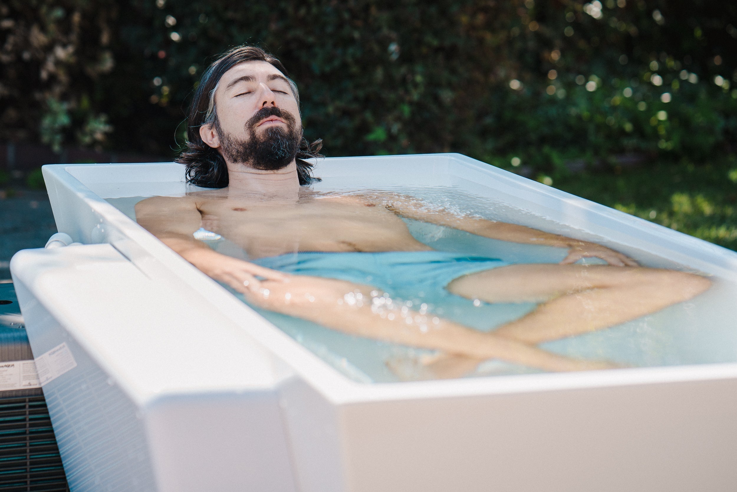 man in cold plunge tub