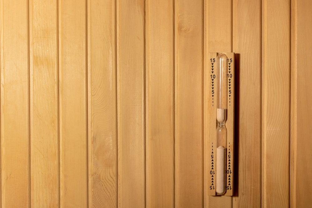 sand timer on a sauna wall