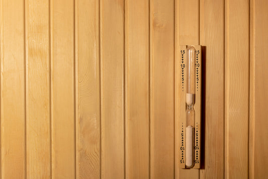 sand timer on a sauna wall