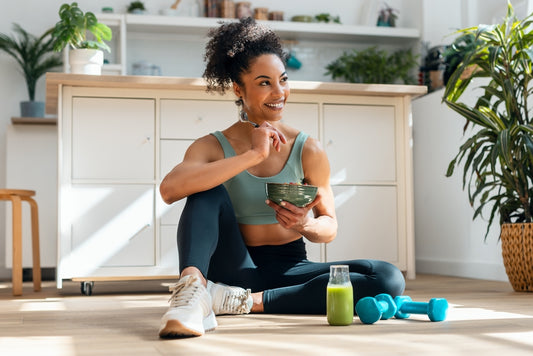 young fit woman eating healthy food