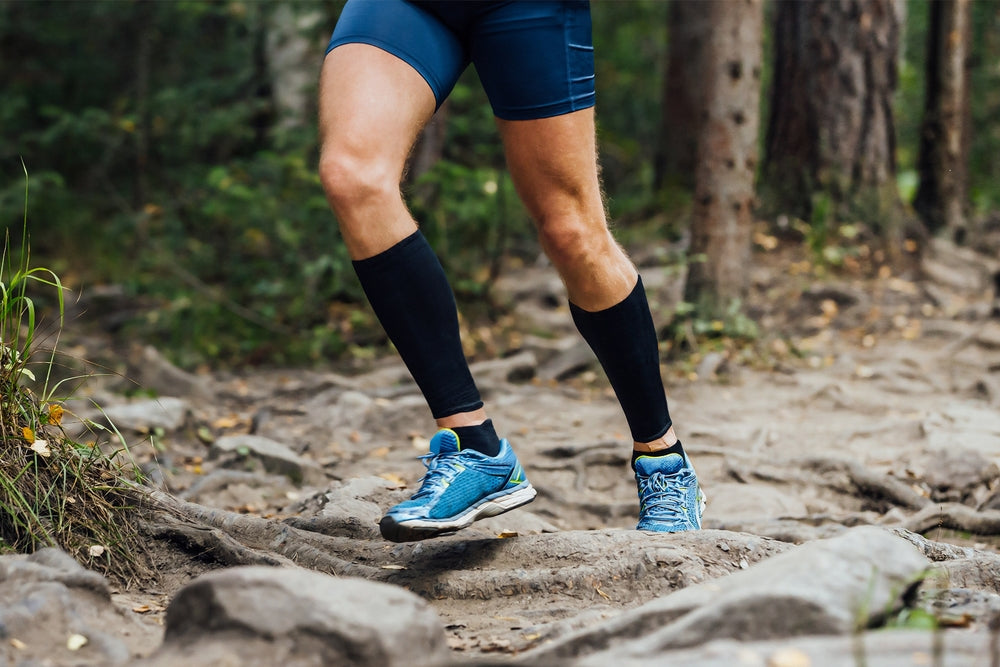person running in compression socks